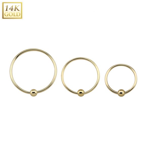 Gold nose ring with small fixed ball